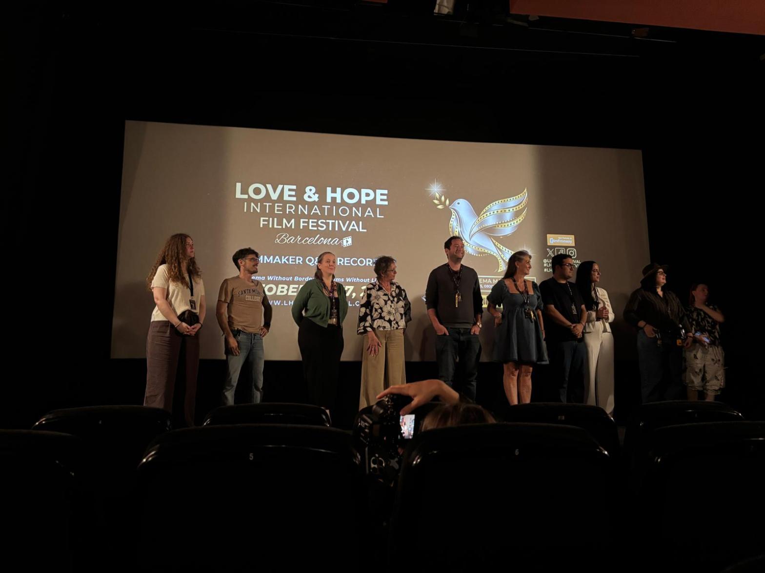 A line of filmmakers on stage at the Love and Hope Film Festival in Barcelona, 17 October 2026